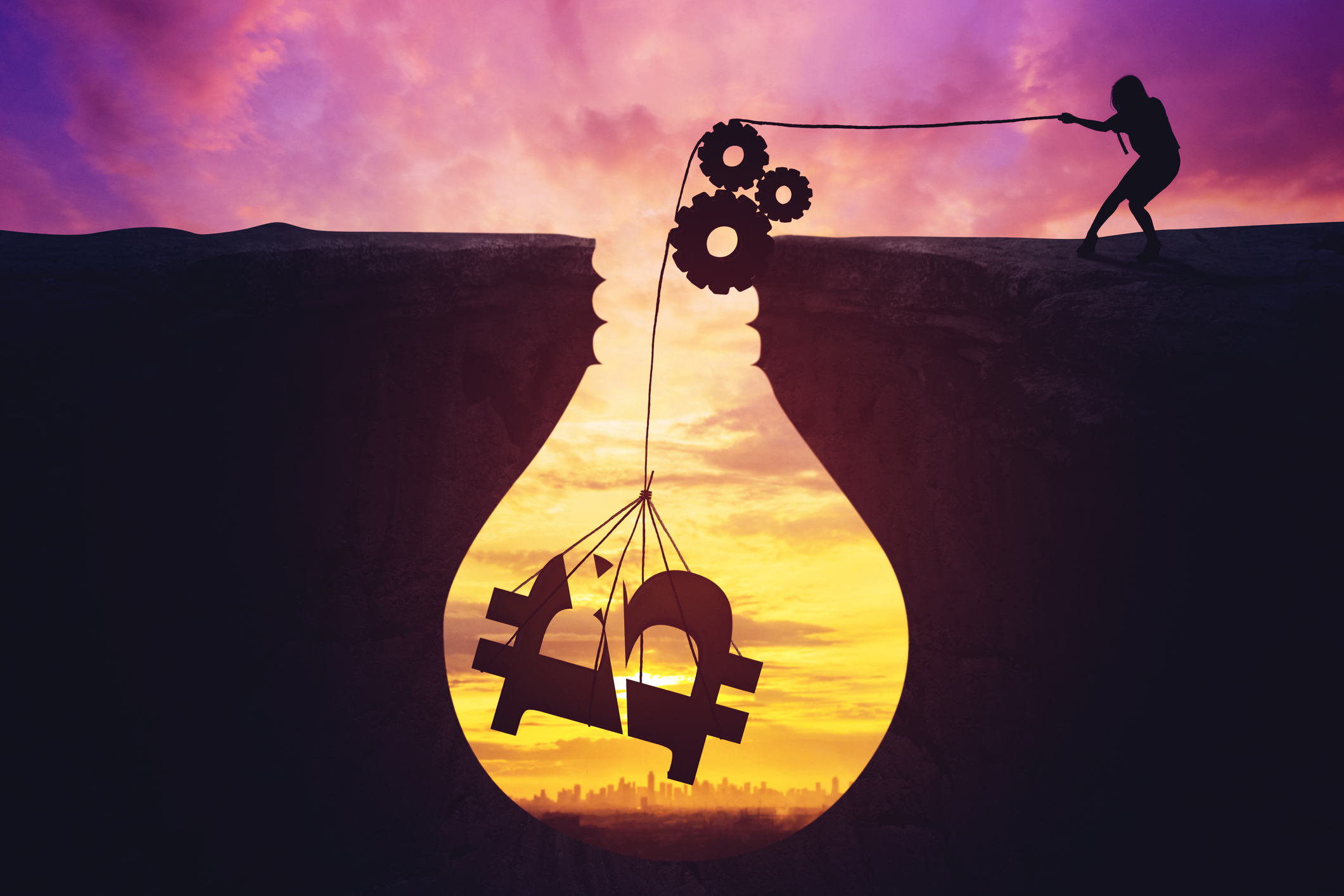 Silhouette of a bitcoin miner pulling a bitcoin logo from a hole
