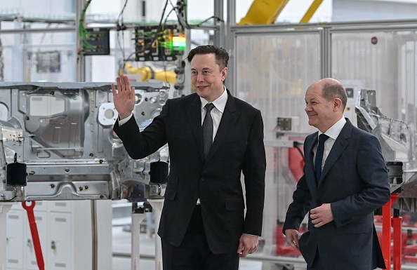 The Technoking and Germany’s chancellor christen Tesla’s first European factory  [Patrick Pleul/Getty Images]