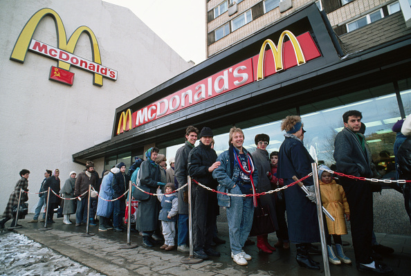 Crowds line up for the opening of Russia’s first McDonald’s in 1990 [Peter Turnley/Getty Images]