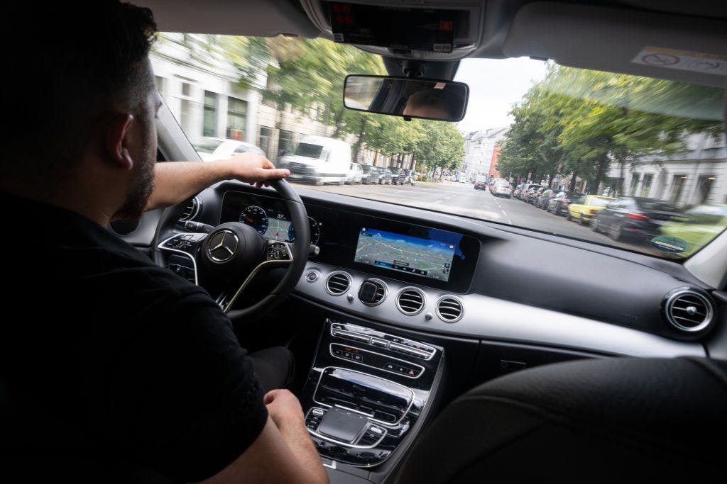 Uber’s having drivers train its AI while partnering with robotaxi companies that could replace them